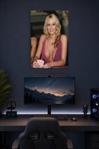Stormy Daniels Playing Poker in a gaming desk setup above a monitor.