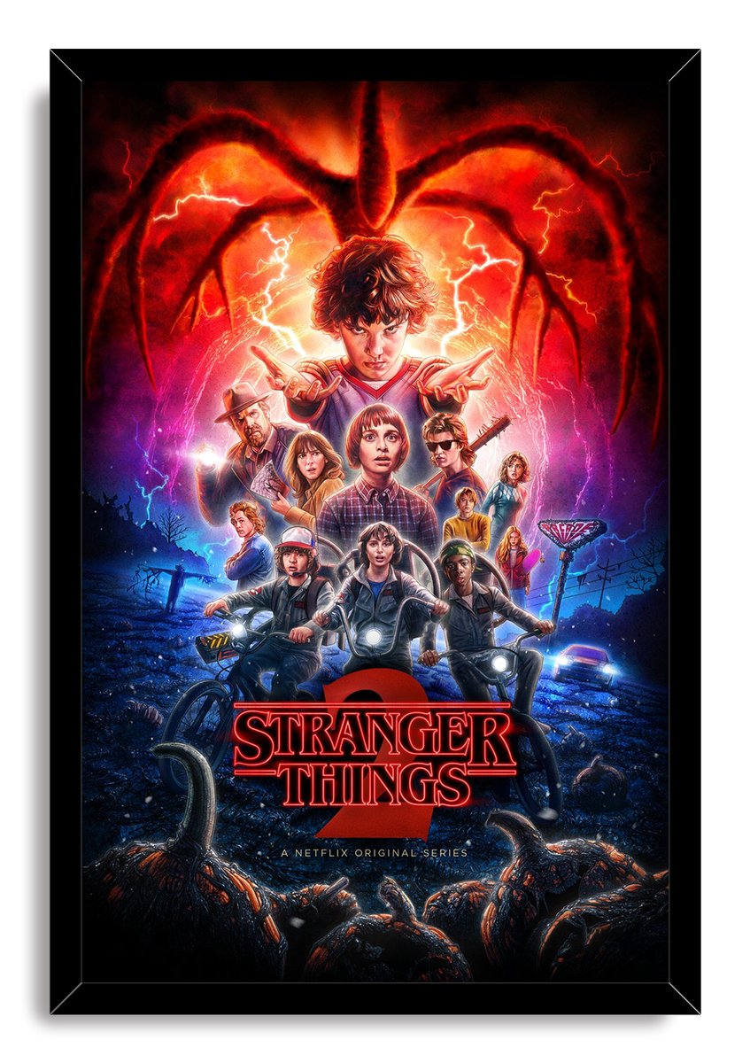 Stranger Things 2 framed wall art print with Eleven, young heroes on bicycles, a red monster silhouette, lightning, and logo.