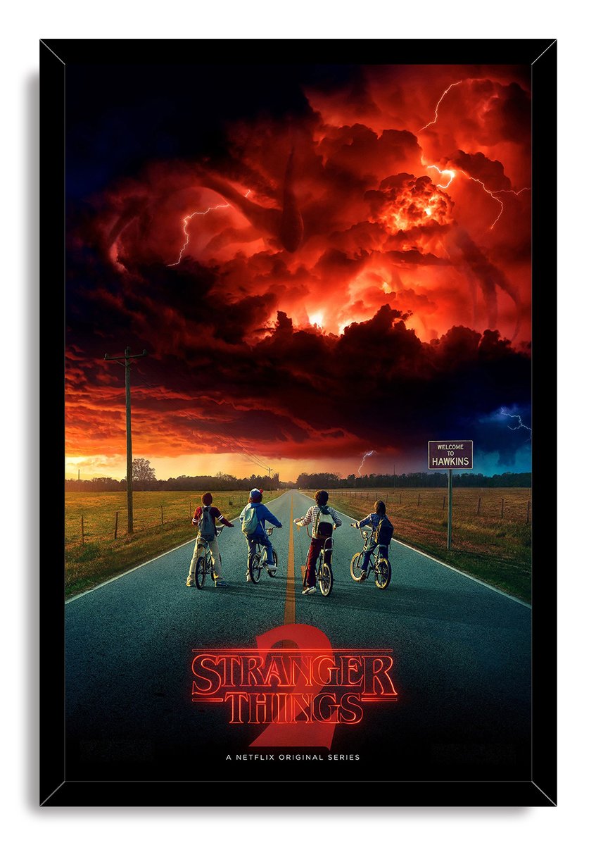 Stranger Things 2 framed wall art print features four boys with bicycles facing a red, lightning-filled sky over Hawkins.