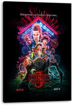 Stranger Things 3 canvas wall art print displays Eleven and the ensemble beneath Starcourt Mall neon, fireworks, and a monster.