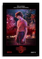 Mike Wheeler Stranger Things 3 framed wall art print portrays Mike beneath fireworks, with a glowing carnival behind him.