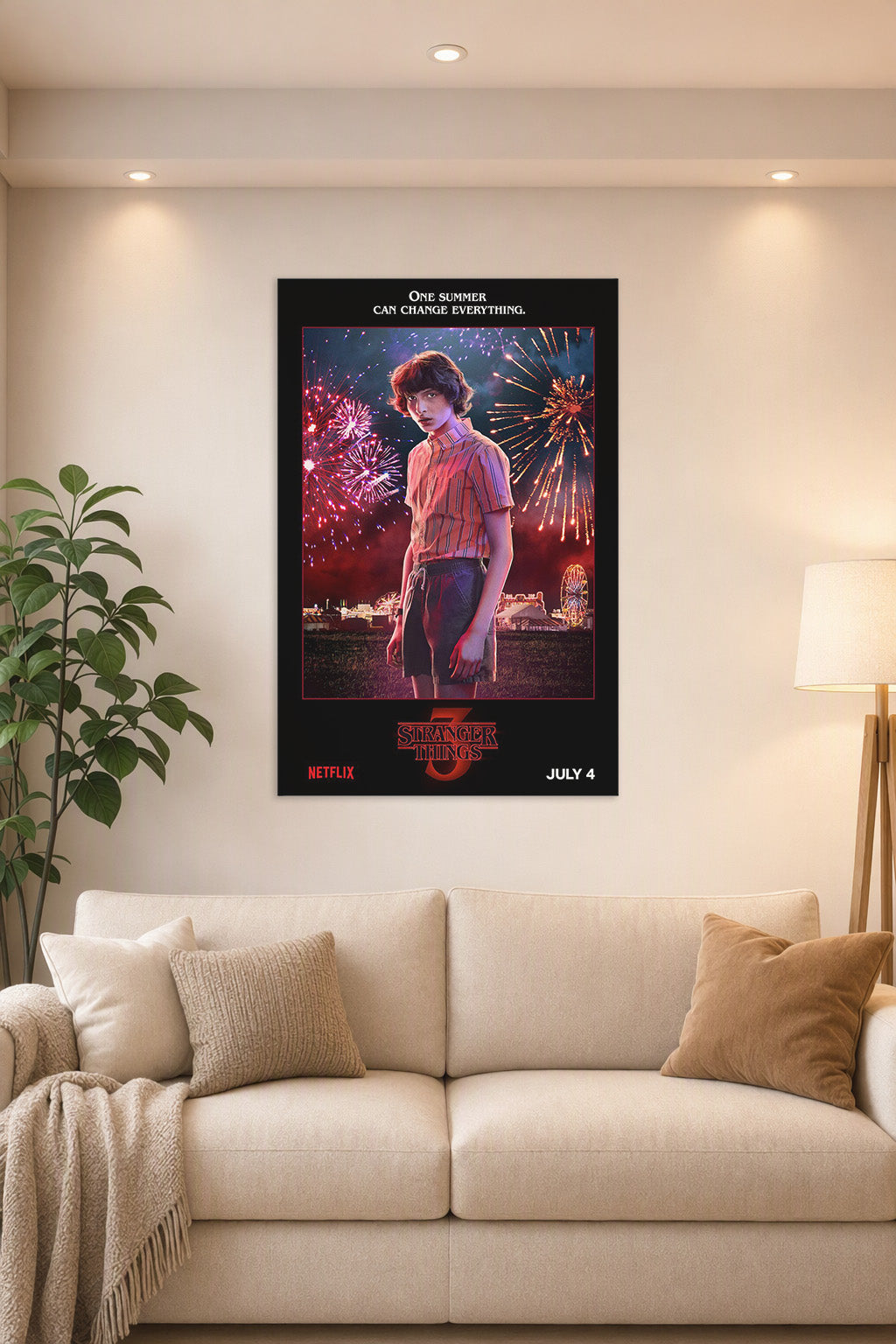 Stranger Things 3 Mike Wheeler in a bright living room above a beige sofa.