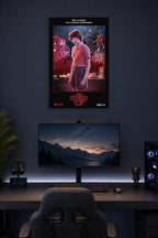 Stranger Things 3 Mike Wheeler in a gaming desk setup above a monitor.