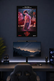 Stranger Things 3 Mike Wheeler in a gaming desk setup above a monitor.