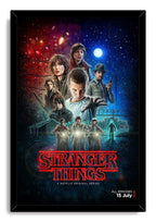 Stranger Things framed wall art print presents Eleven, cast portraits, three riders, a moonlit fenced compound, and red title lettering.