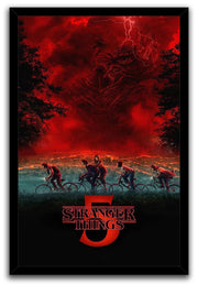 Stranger Things 5 framed wall art print portrays bicycle riders, dark trees, lightning, and a giant face in a red cloudscape.