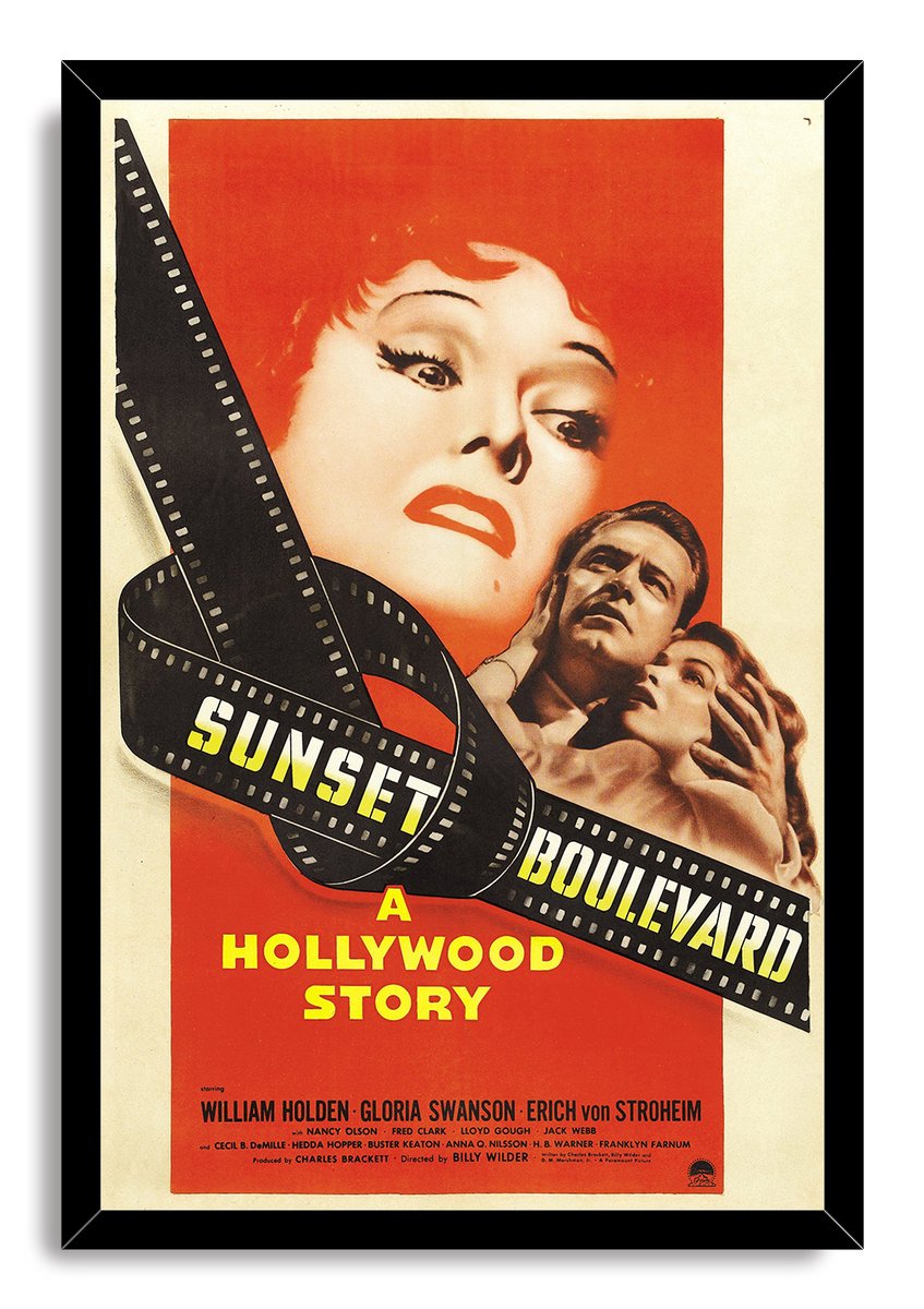 Sunset Boulevard movie poster wall art print in a black frame, with film strip typography, dramatic portraits, and red background.