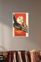 Sunset Boulevard Movie Poster in a cozy movie room above a brown sofa with popcorn.
