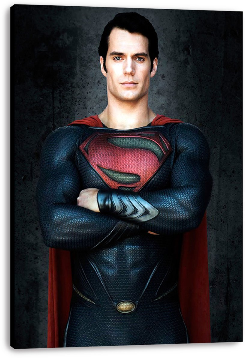 Superman canvas wall art print featuring Henry Cavill standing with crossed arms, a red cape, and dark textured backdrop.