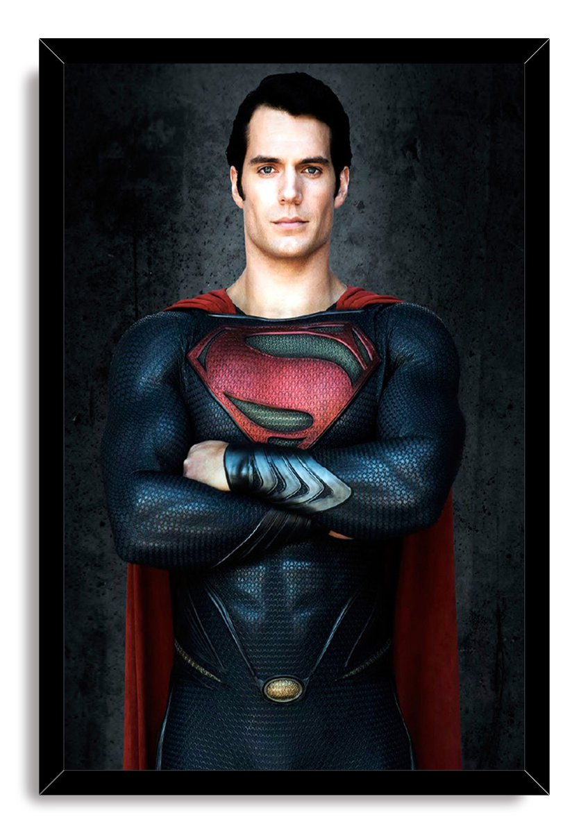 Superman framed wall art print featuring Henry Cavill in a blue suit with crossed arms, red cape, and black border.