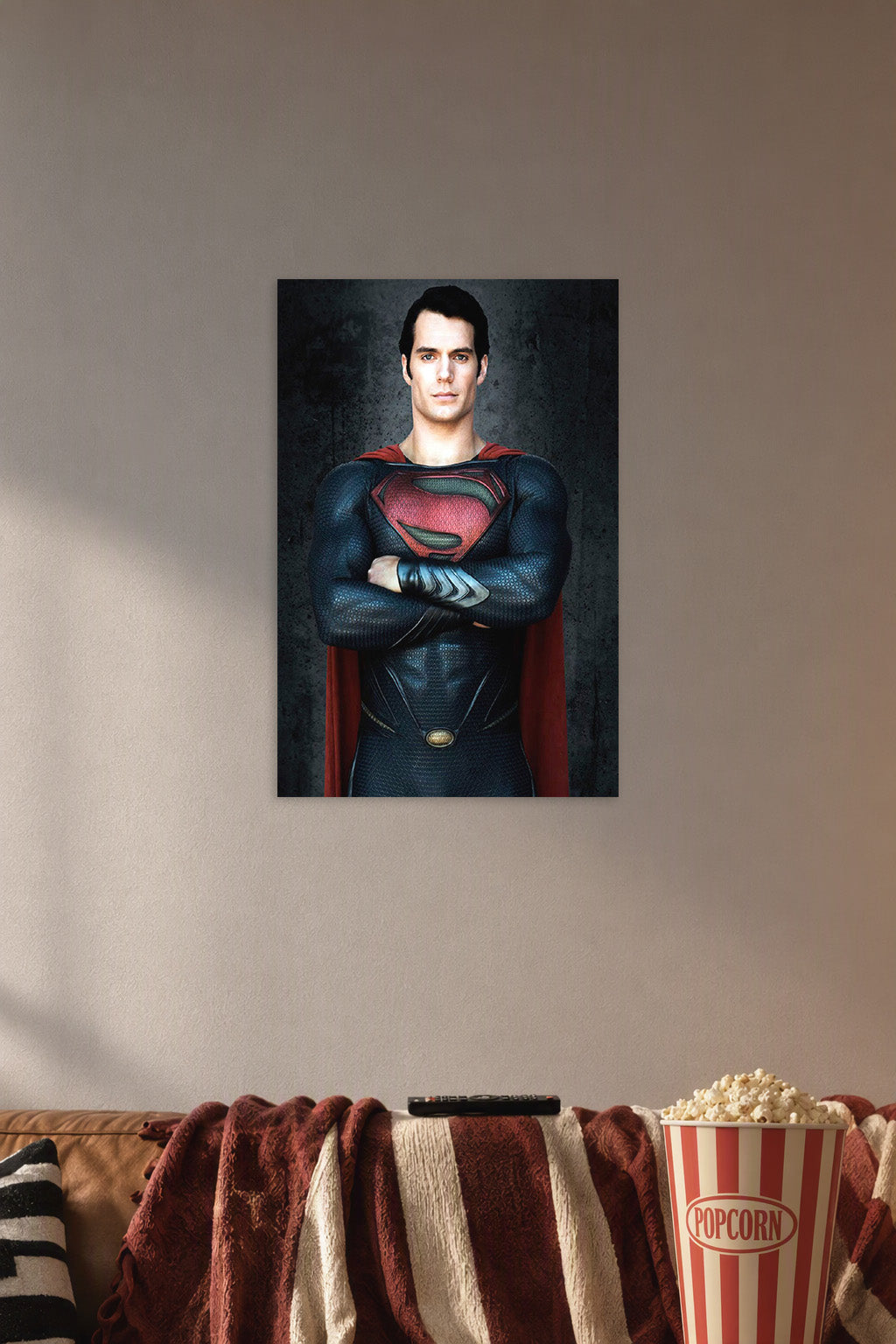 Superman Henry Cavill in a cozy movie room above a brown sofa with popcorn.