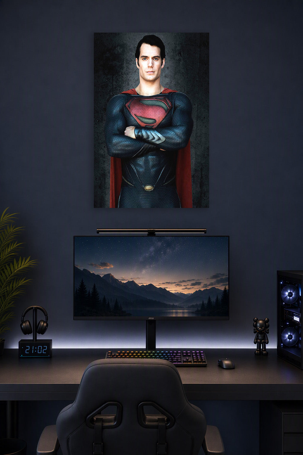 Superman Henry Cavill in a gaming desk setup above a monitor.