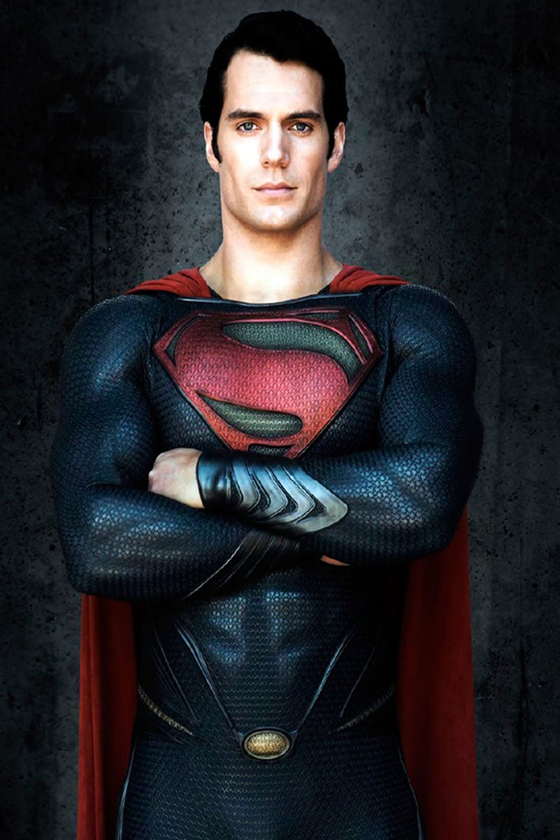 Superman wall art print featuring Henry Cavill with arms crossed in a textured blue suit, red cape, and red chest emblem.