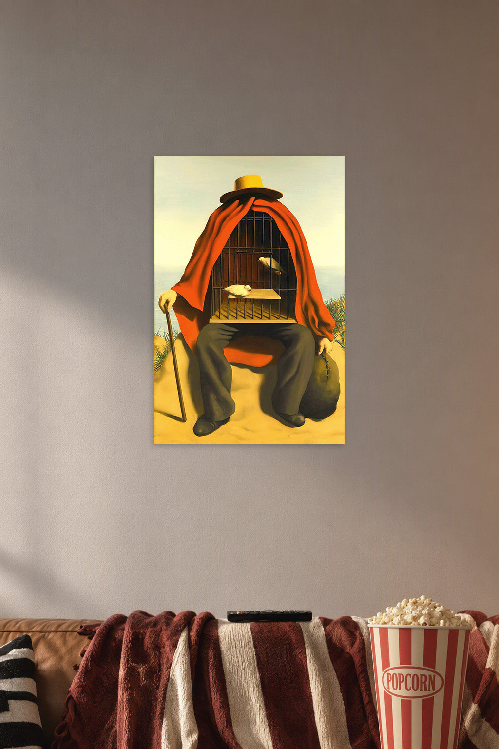 Surreal Cage Man in a cozy movie room above a brown sofa with popcorn.