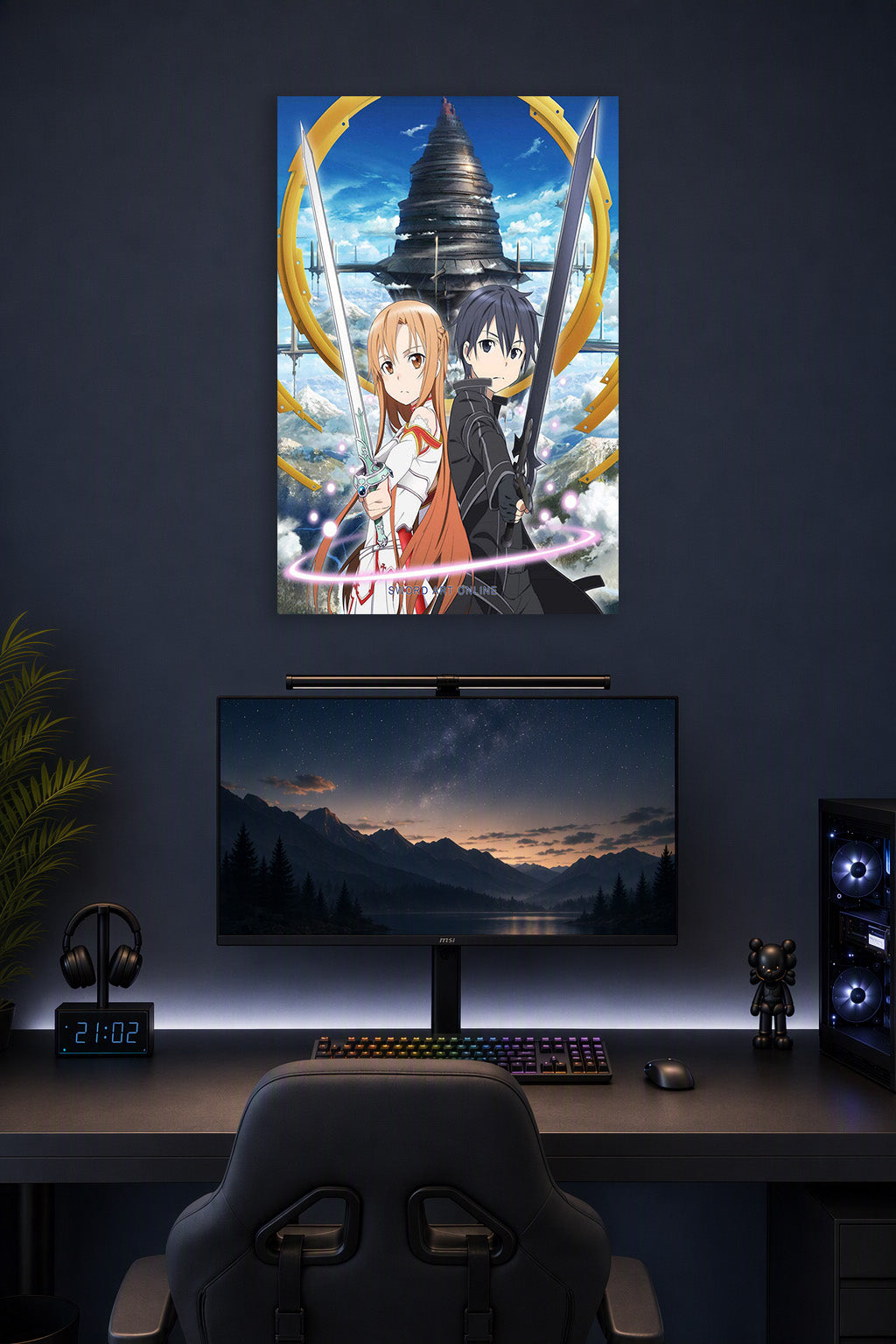 Sword Art Online Kirito and Asuna in a gaming desk setup above a monitor.