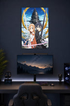 Sword Art Online Kirito and Asuna in a gaming desk setup above a monitor.