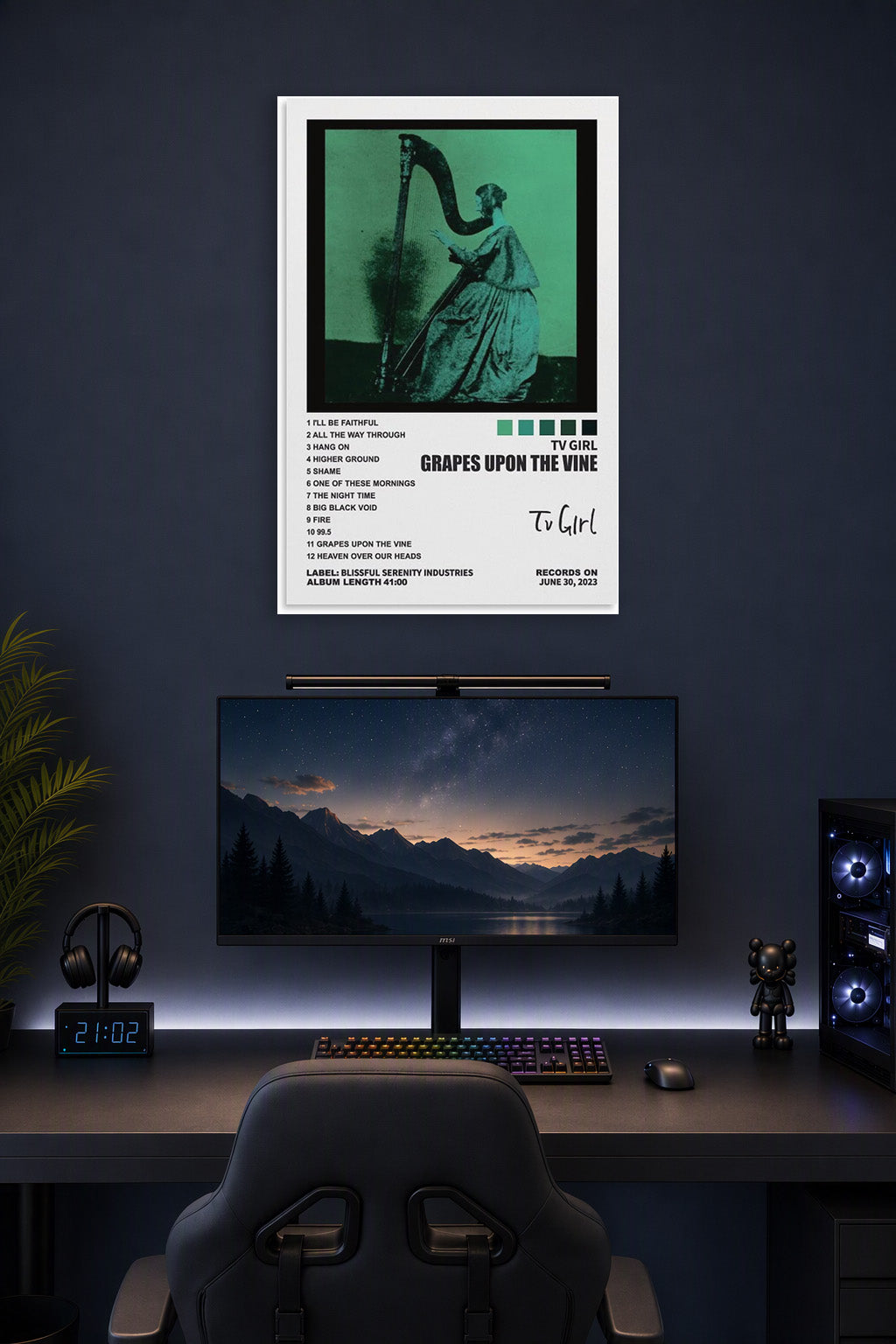TV Girl Poster Grapes Upon The Vine Album Cover Posters in a gaming desk setup above a monitor.