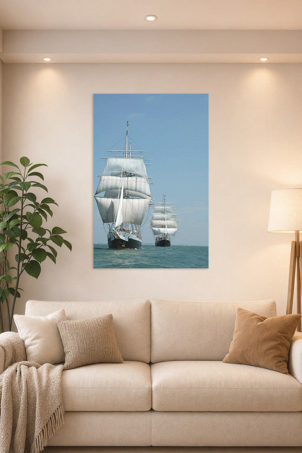 Tall Ships at Sea in a bright living room above a beige sofa.