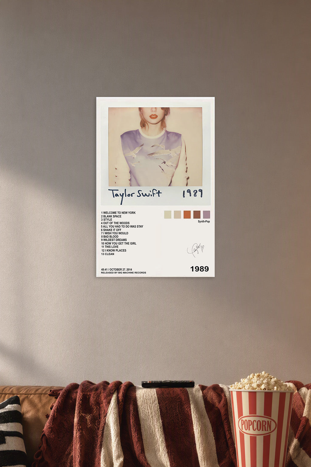 Taylor Swift 1989 Album in a cozy movie room above a brown sofa with popcorn.