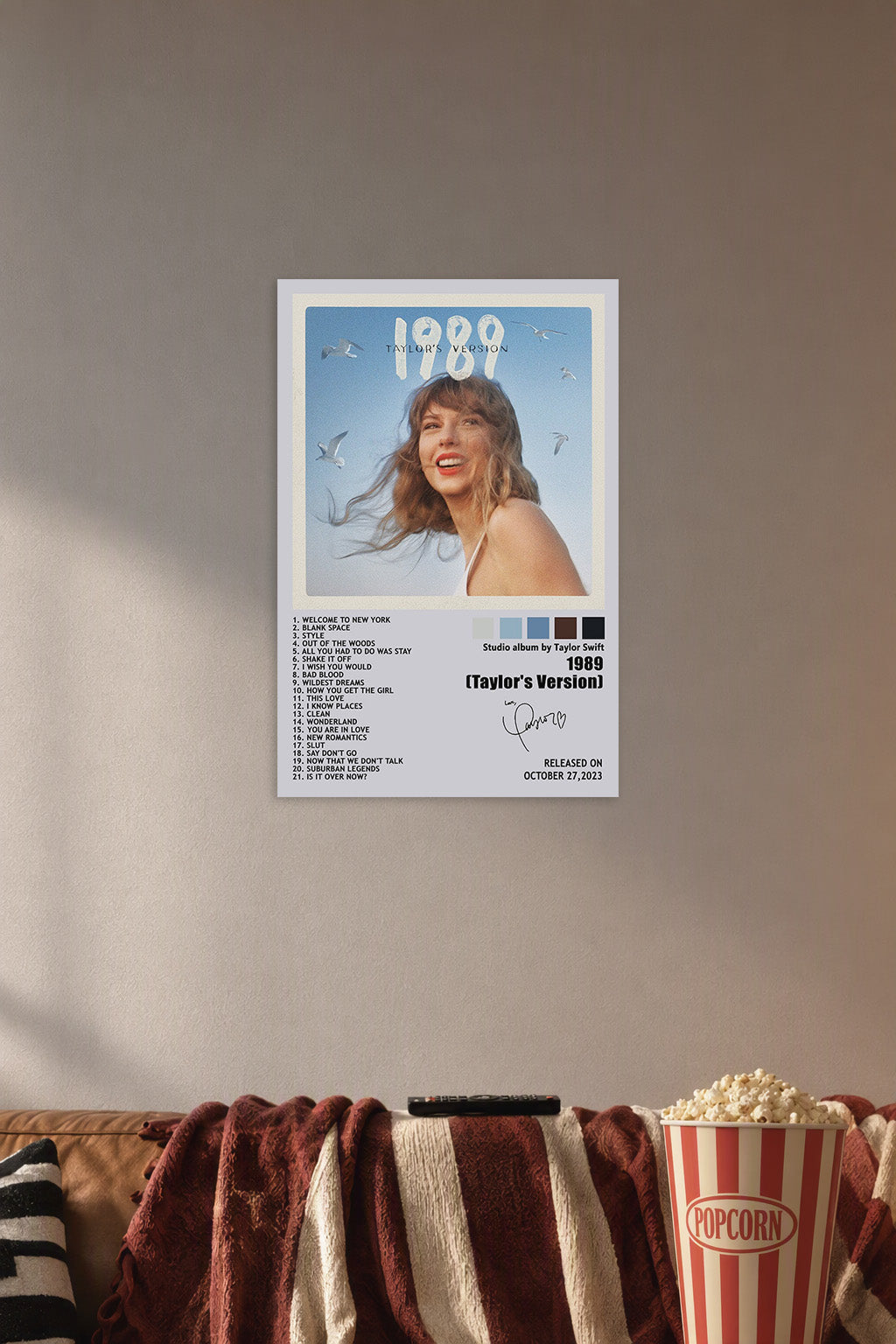 Taylor Swift 1989 (Taylor's Version) in a cozy movie room above a brown sofa with popcorn.