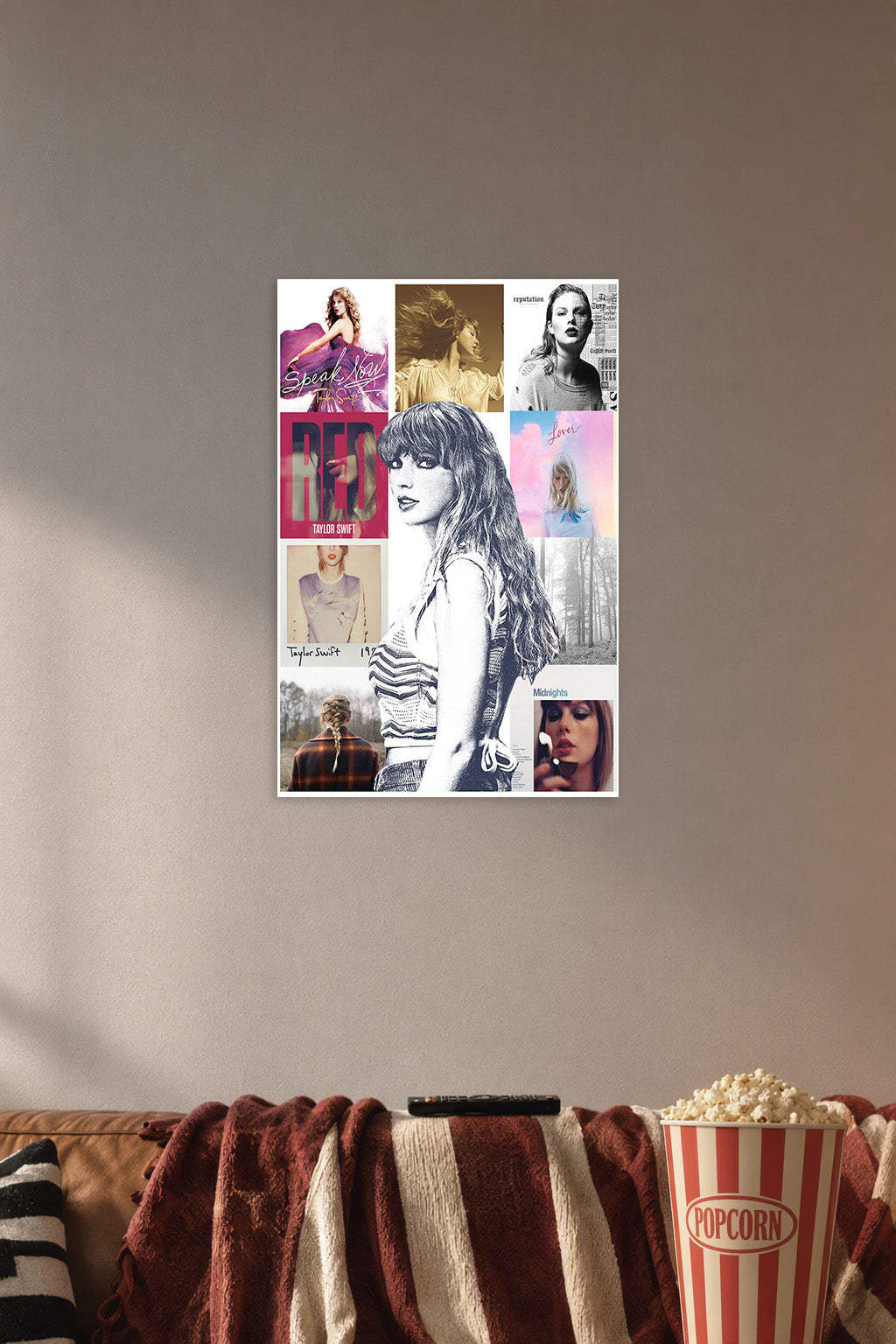 Taylor Swift Album Art Collage in a cozy movie room above a brown sofa with popcorn.