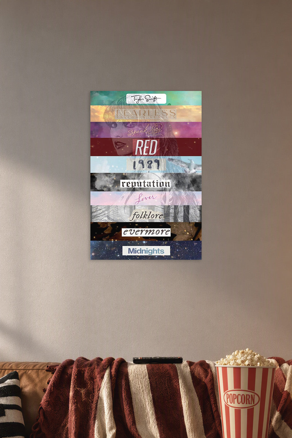 Taylor Swift Album Eras in a cozy movie room above a brown sofa with popcorn.