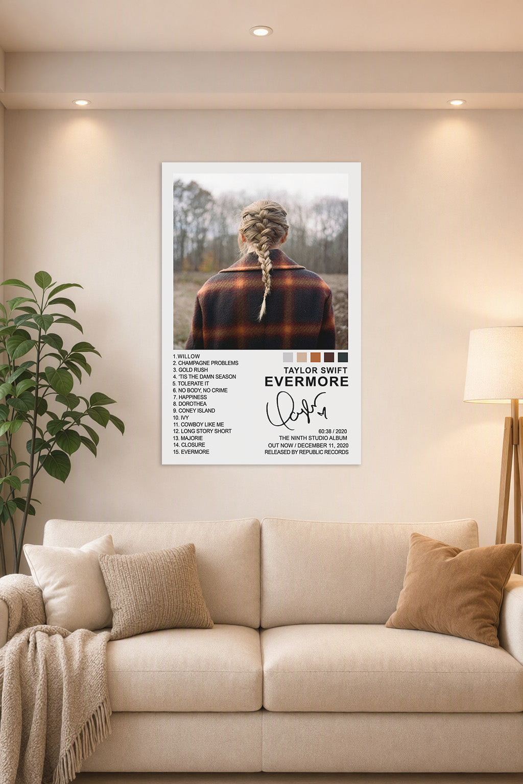 Taylor Swift Evermore Album Cover in a bright living room above a beige sofa.