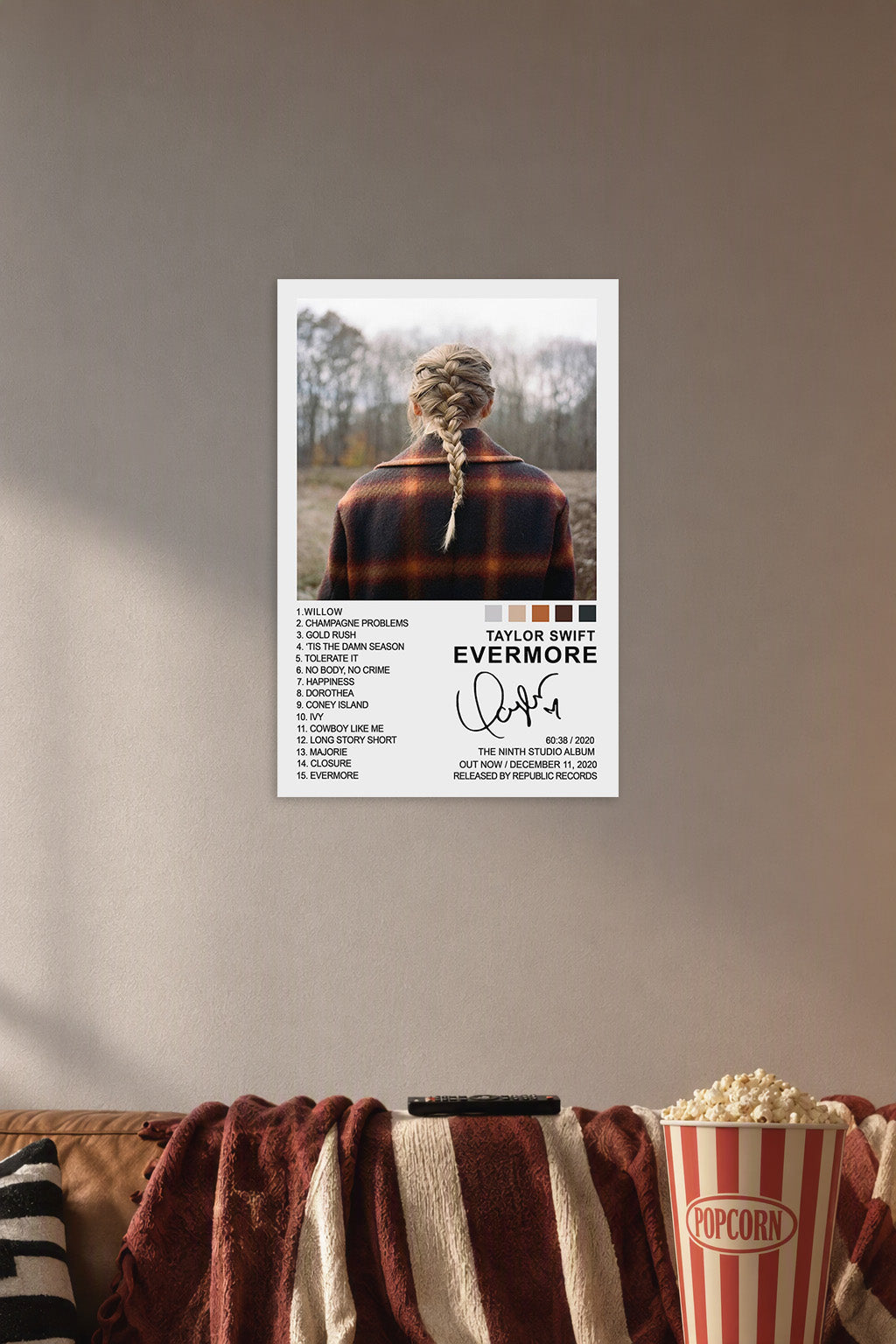 Taylor Swift Evermore Album Cover in a cozy movie room above a brown sofa with popcorn.