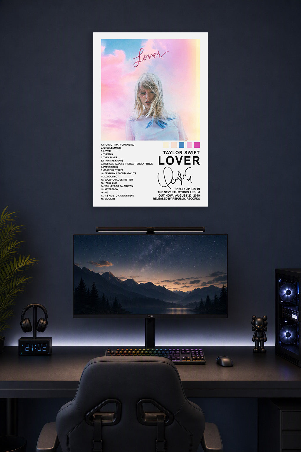 Taylor Swift Lover Album in a gaming desk setup above a monitor.