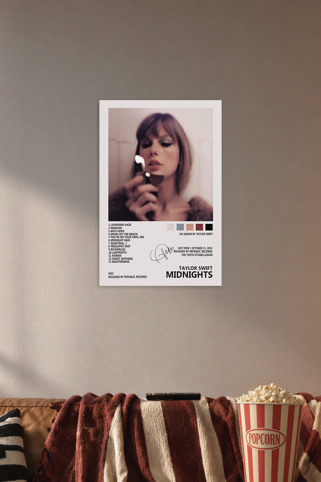 Taylor Swift "Midnights" Album Art in a cozy movie room above a brown sofa with popcorn.
