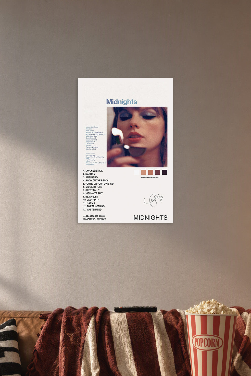 Taylor Swift Midnights Album in a cozy movie room above a brown sofa with popcorn.