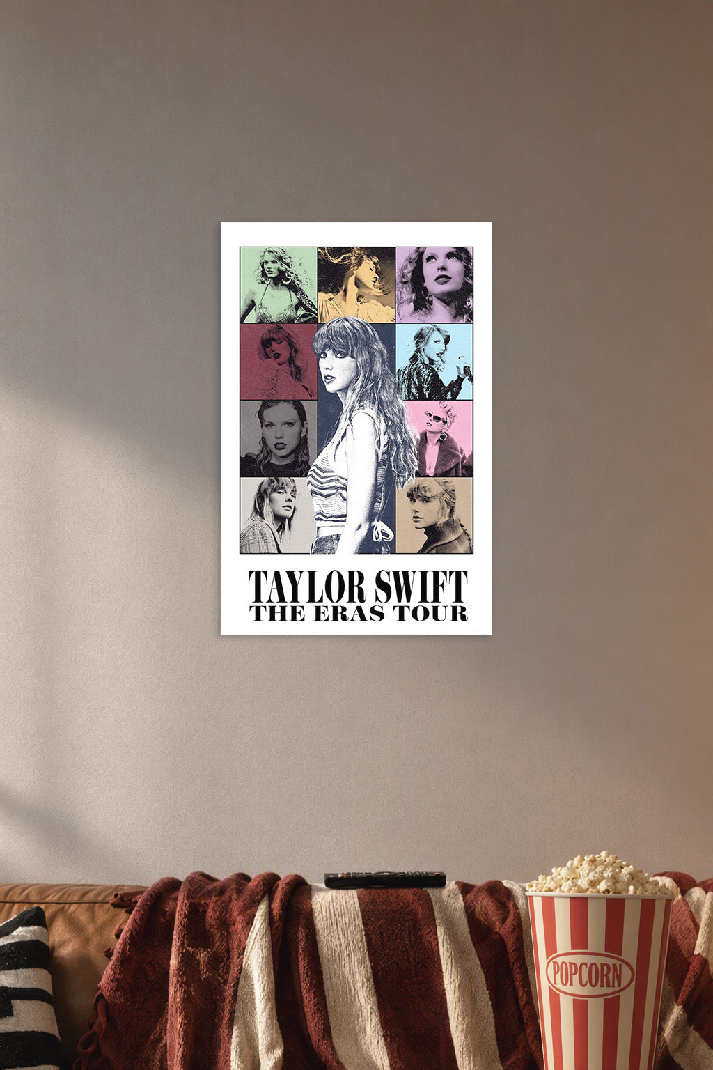 Taylor Swift The Eras Tour in a cozy movie room above a brown sofa with popcorn.