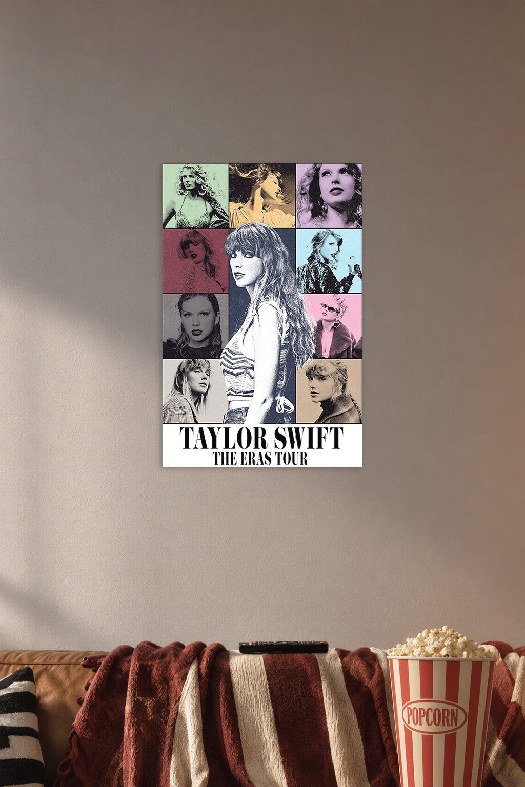 Taylor Swift The Eras Tour in a cozy movie room above a brown sofa with popcorn.