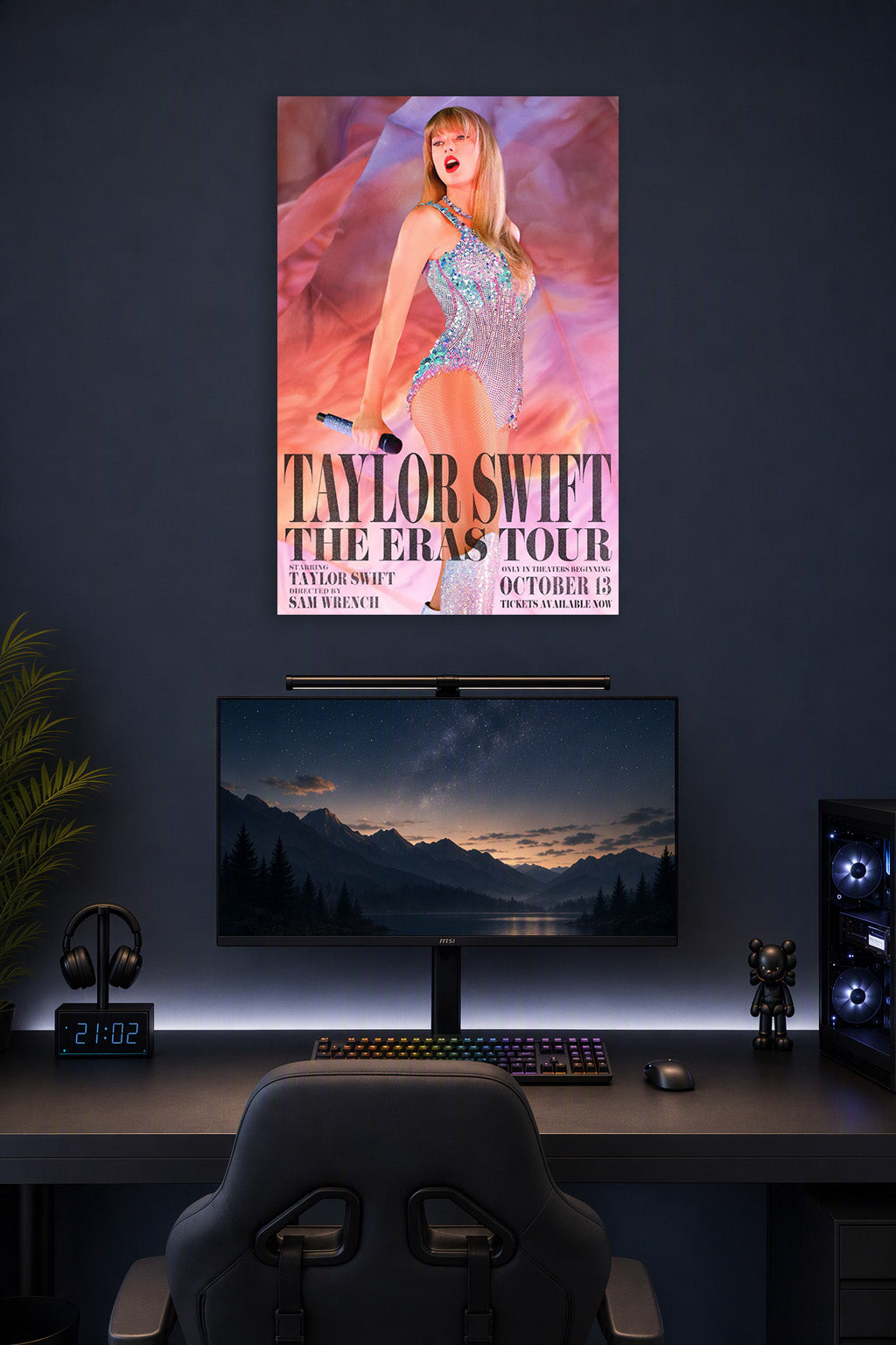 Taylor Swift The Eras Tour in a gaming desk setup above a monitor.
