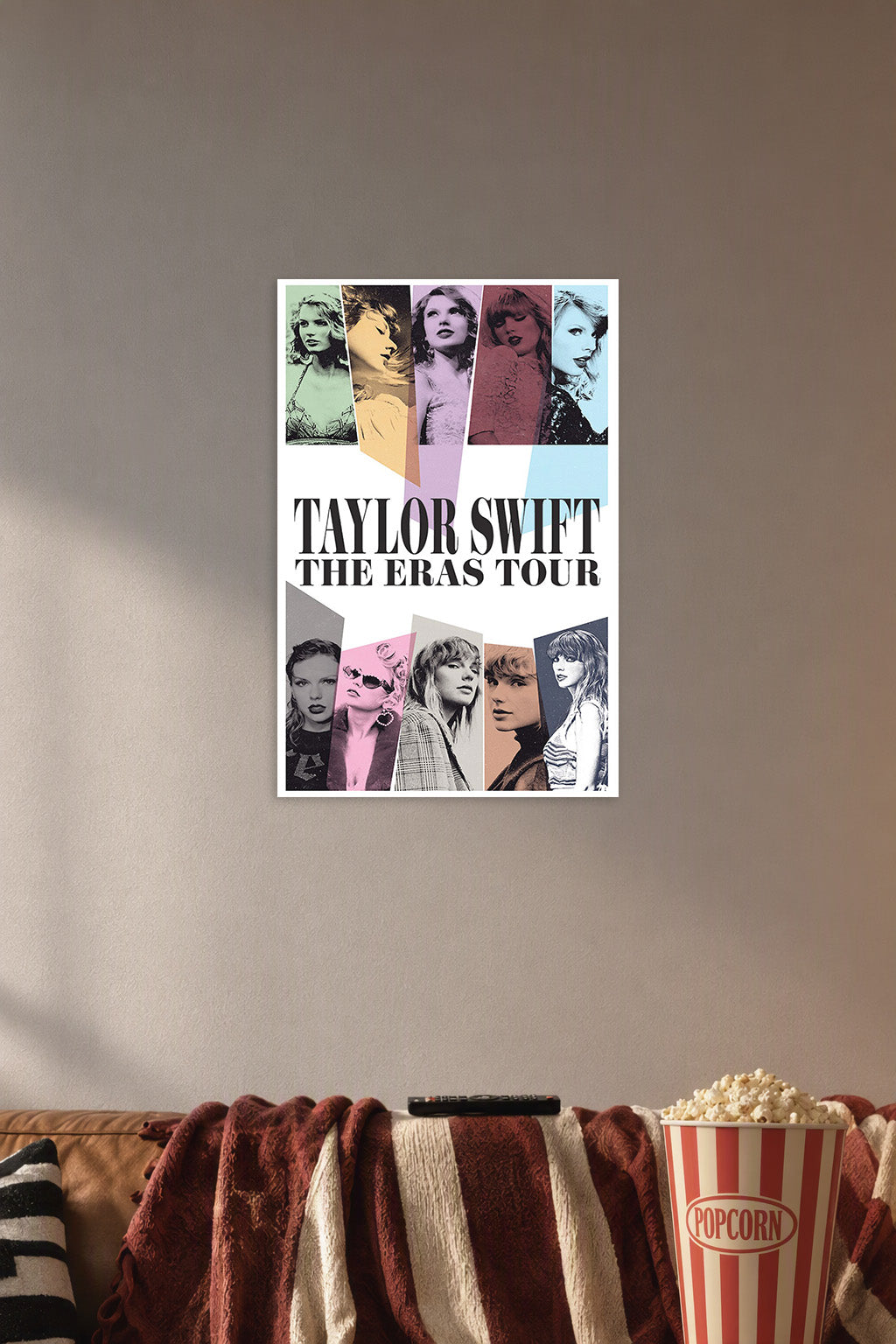 Taylor Swift The Eras Tour in a cozy movie room above a brown sofa with popcorn.