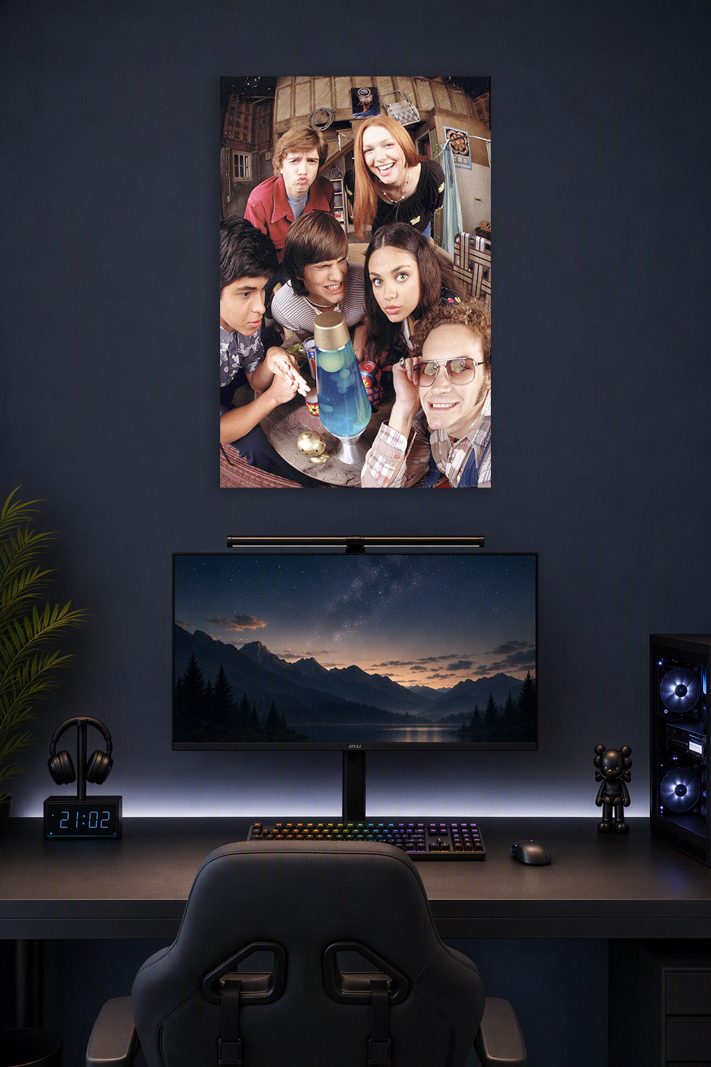 That '70s Show Cast in a gaming desk setup above a monitor.