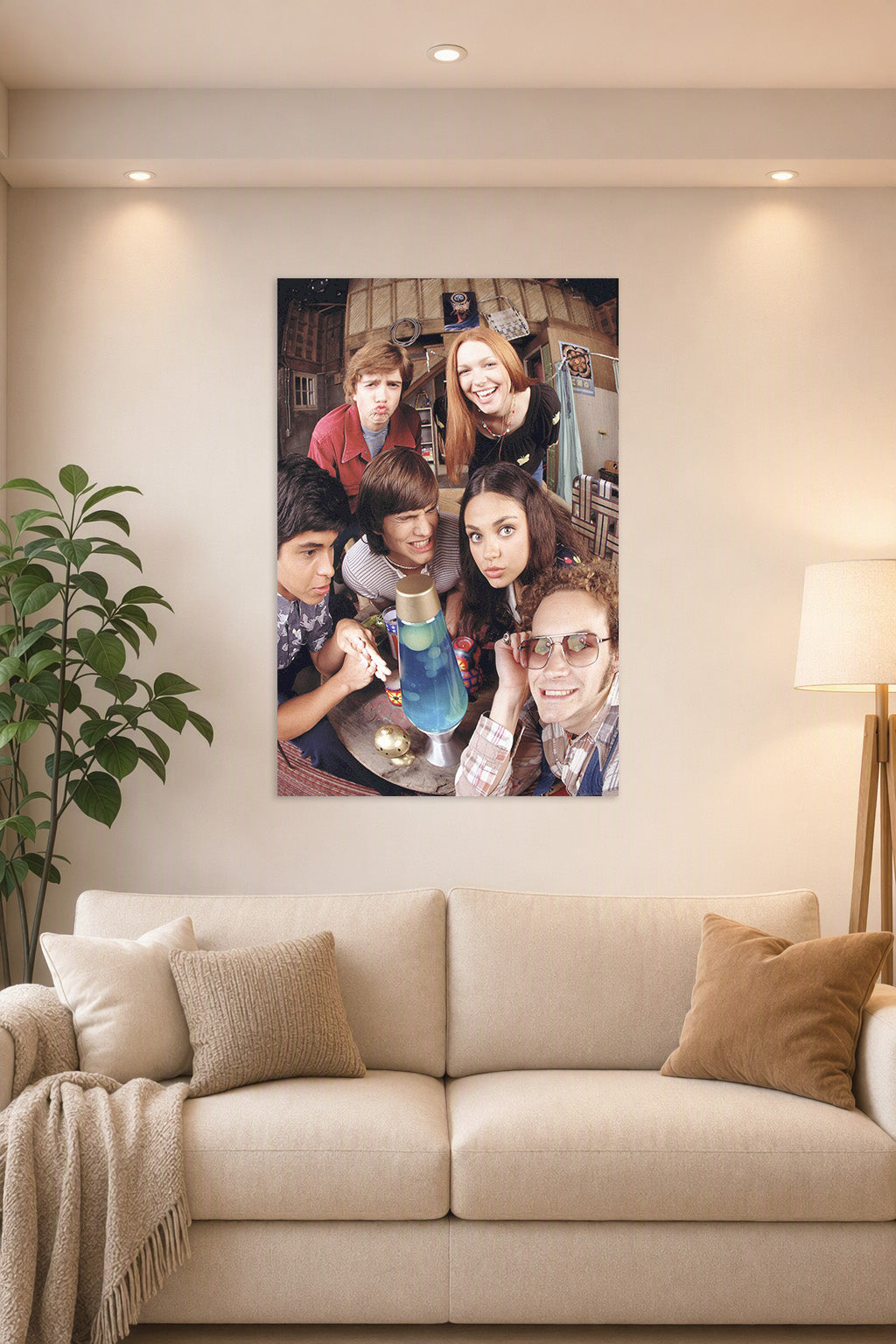 That '70s Show Cast in a bright living room above a beige sofa.