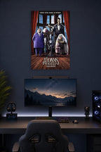 The Addams Family Halloween in a gaming desk setup above a monitor.