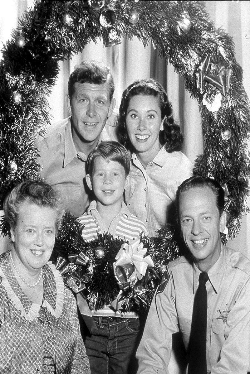 The Andy Griffith Show Christmas poster features five smiling cast members framed by tinsel, ornaments, bows, and garland.