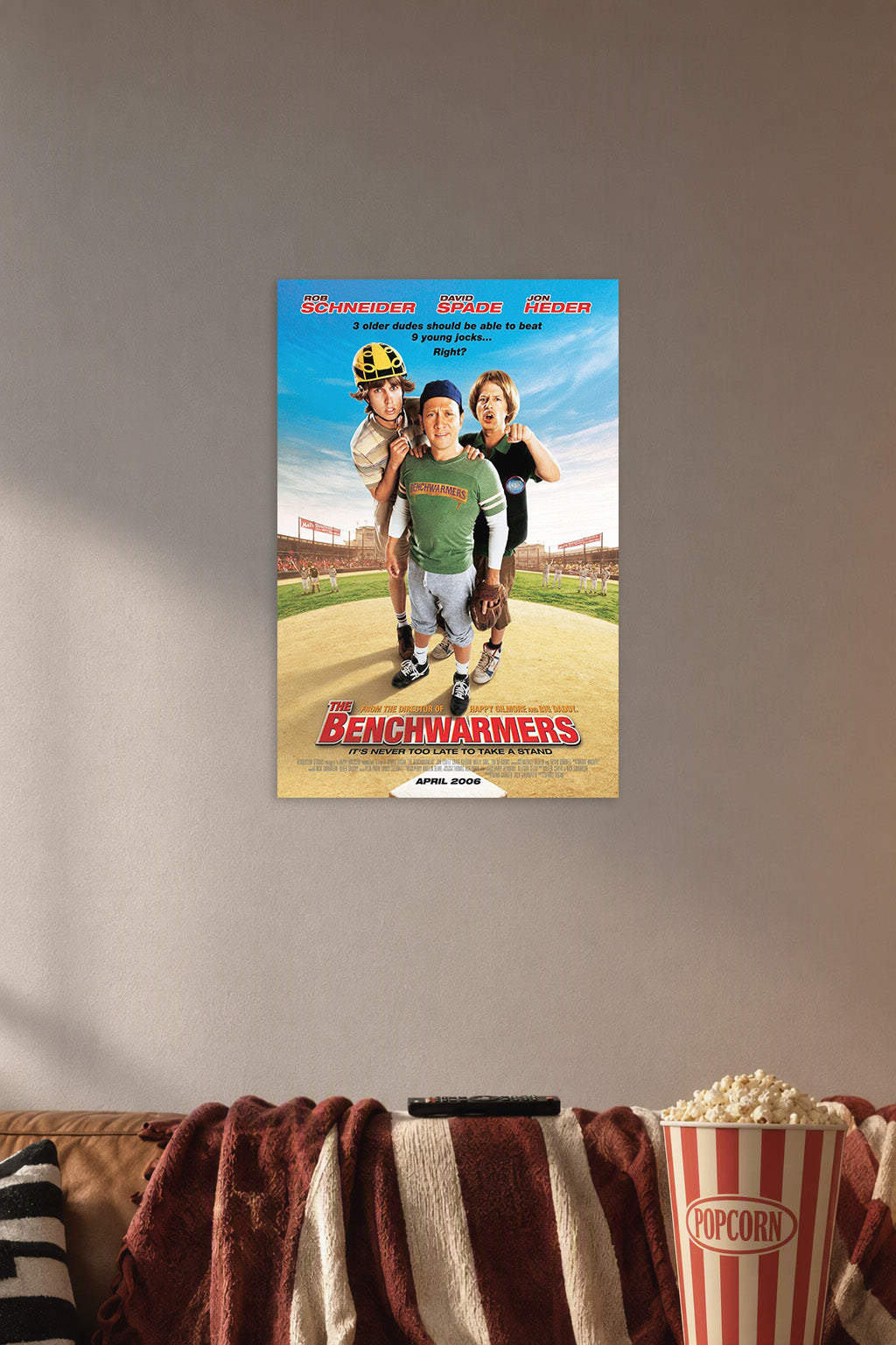 The Benchwarmers Rob Schneider David Spade Jon Heder in a cozy movie room above a brown sofa with popcorn.