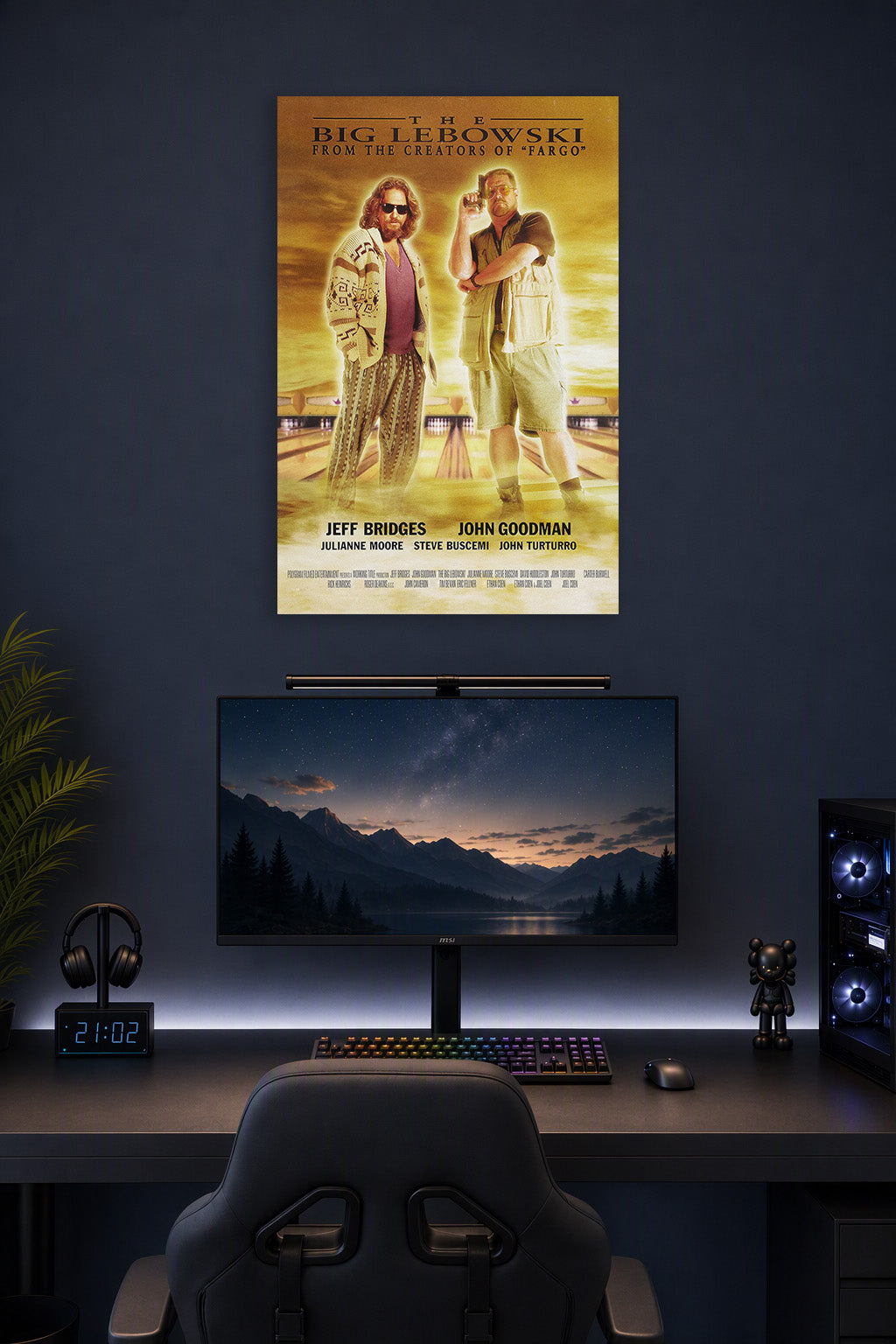 The Big Lebowski Movie Poster in a gaming desk setup above a monitor.