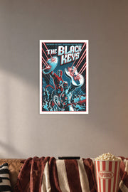 The Black Keys Superhero Duo in a cozy movie room above a brown sofa with popcorn.