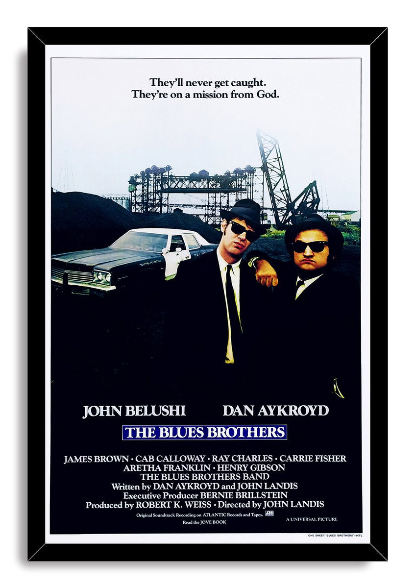 The Blues Brothers framed wall art print presents the sunglassed duo and police car against a gritty industrial backdrop.