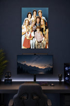 The Brady Bunch Cast in a gaming desk setup above a monitor.