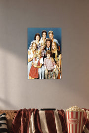 The Brady Bunch Cast in a cozy movie room above a brown sofa with popcorn.