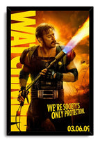 The Comedian framed wall art print presents a cigar-smoking armored man, flamethrower, helicopters, and bold yellow text.