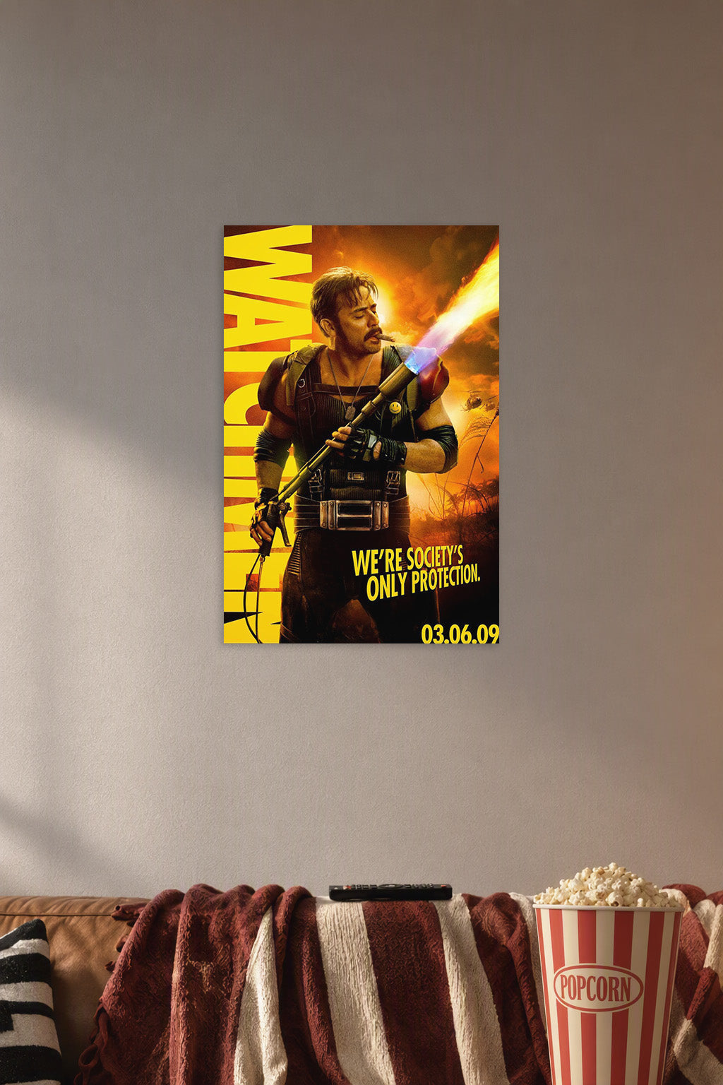 The Comedian from Watchmen in a cozy movie room above a brown sofa with popcorn.