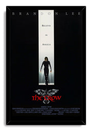 The Crow framed wall art print presents Brandon Lee walking beneath 'Believe in Angels,' with a crow motif and red title.
