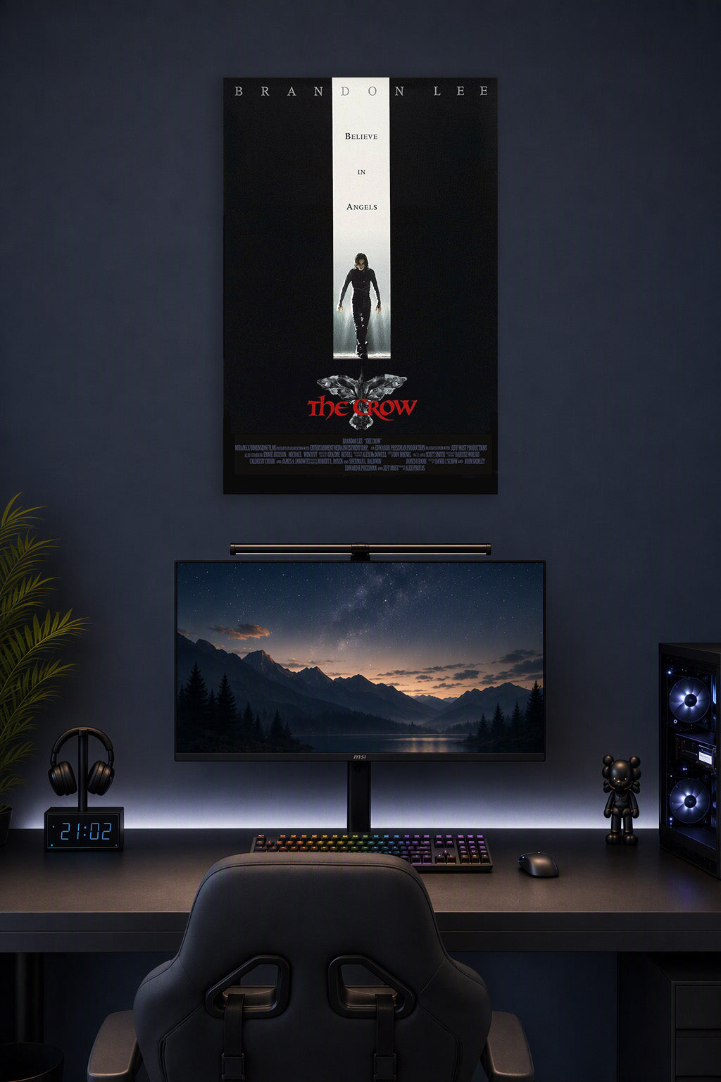 The Crow Brandon Lee in a gaming desk setup above a monitor.