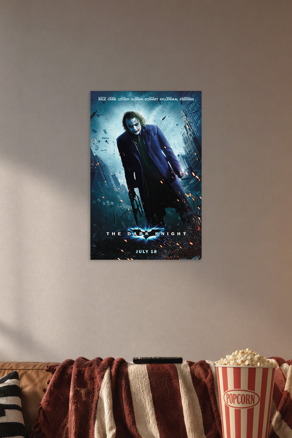 The Dark Knight Joker in a cozy movie room above a brown sofa with popcorn.